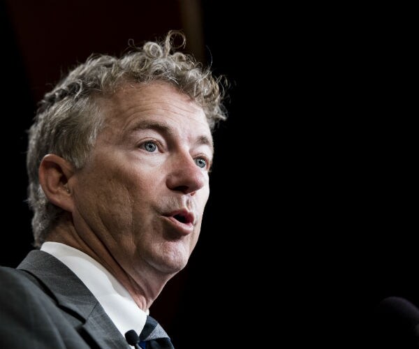 sen. rand paul is shown in dress shirt, suit and tie