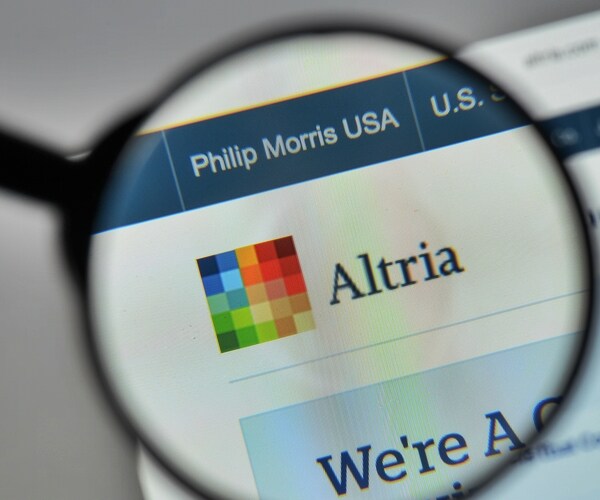 altria corporate logo symbol in magnifying glass