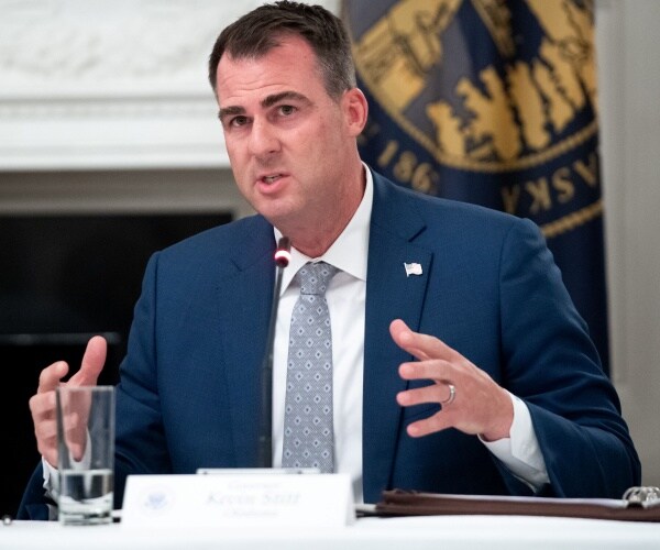 kevin stitt speaks at a roundtable event