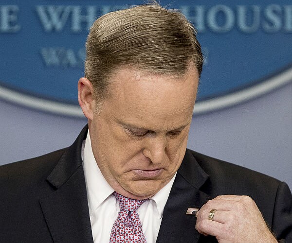 Spicer Wears Upside Down American Flag Lapel Pin