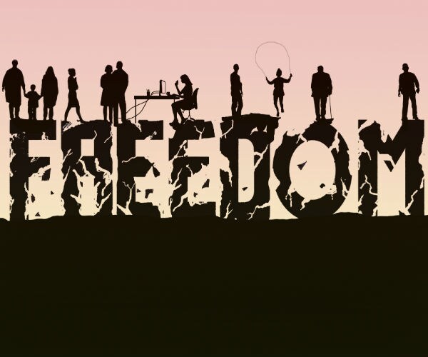 The word 'freedom' crumbling beneath people (Ikon Images via AP Images)