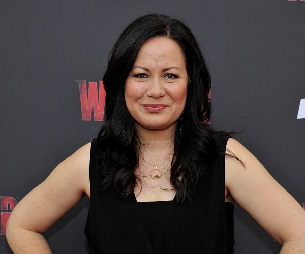 shannon lee stands on red carpet