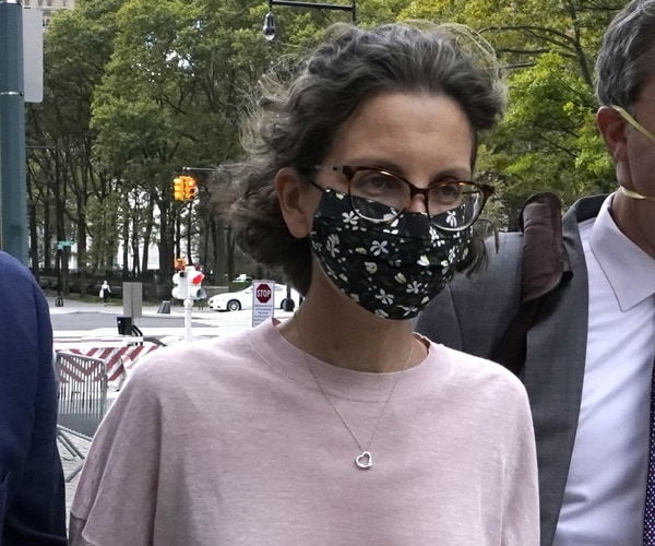 clare bronfman wears a mask and walks on the streets of new  york