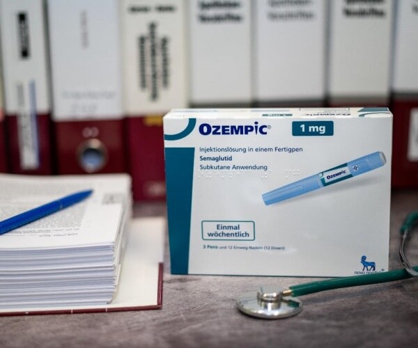 a box of Ozempic and some papers