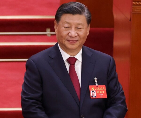 chinese president xi jinping with id badge