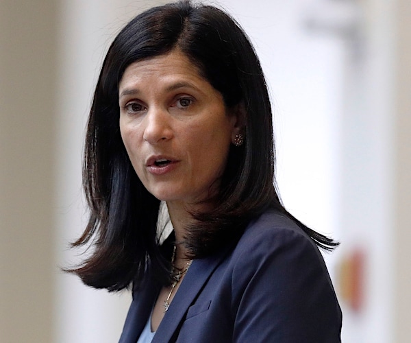 Sara Gideon looks to her left during a campaign rally speech