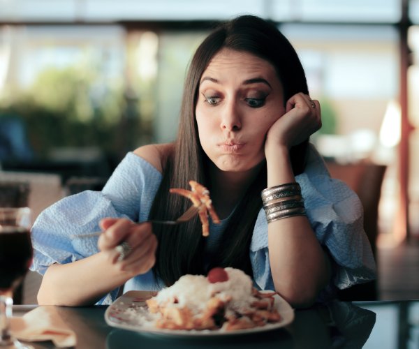 Woman eating a big meal