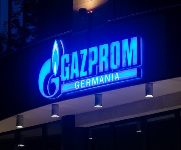  logo and sign of gazprom germania in neon blue