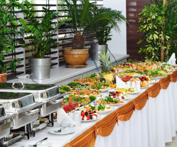 banquet table with chafing dish heaters and canapes