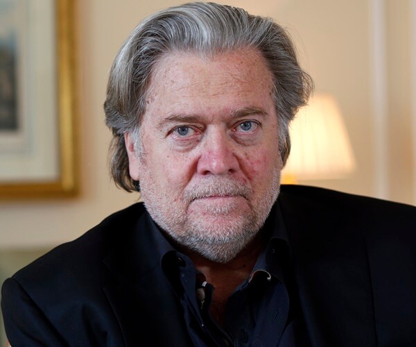 steve bannon looks into camera before an interview