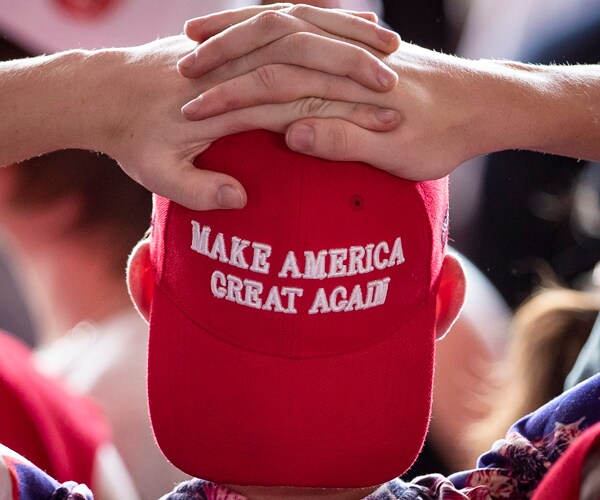 A man wearing a "Make America Great Again" hat