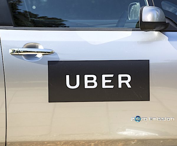 a car has an uber decal on its passenger door