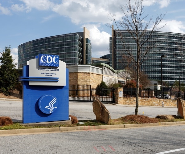 cdc headquarters is shown in atlanta georgia with a sign in front of a large building