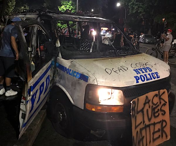 black lives matter militants destroy a police van and paint dead cops on its hood