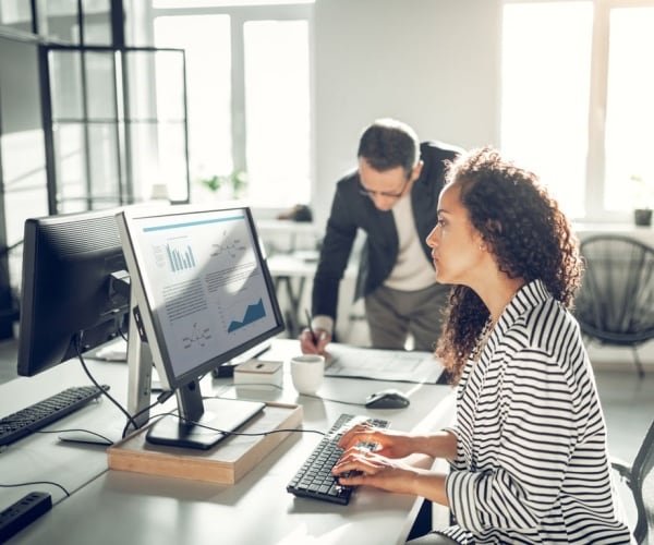 man and woman in office