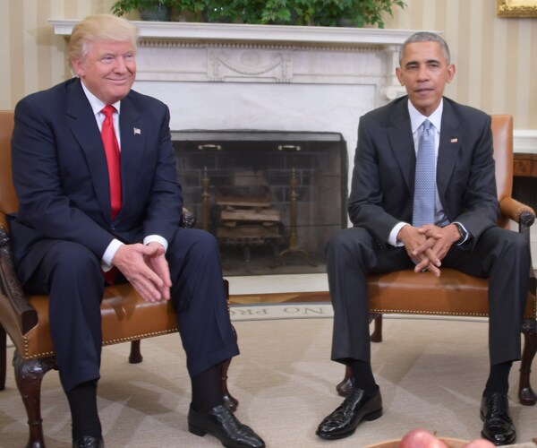 donald trump and barack obama sitting next to each other in the oval office