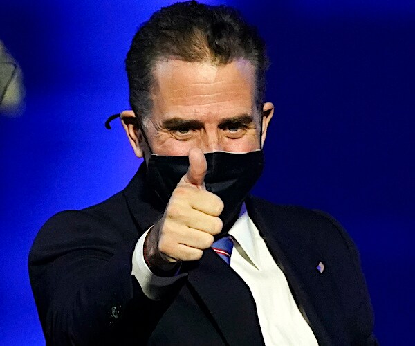 hunter biden gives thumbs up at his father's election victory rally