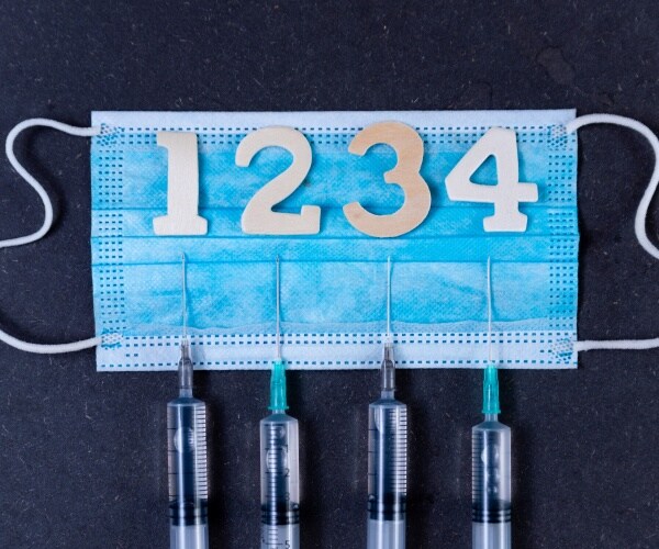 disposable facemask with 4 syringes and the numbers 1, 2, 3, 4