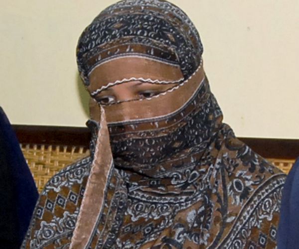 in this 2010, file photo, asia bibi, a pakistani christian woman, listens to officials at a prison in sheikhupura.