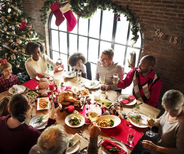 extended family at dinner table at Christmas