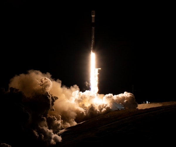 a spacex rocket lifts off 