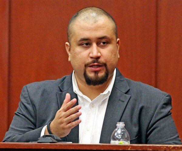 george zimmerman sits on the stand in a courtroom