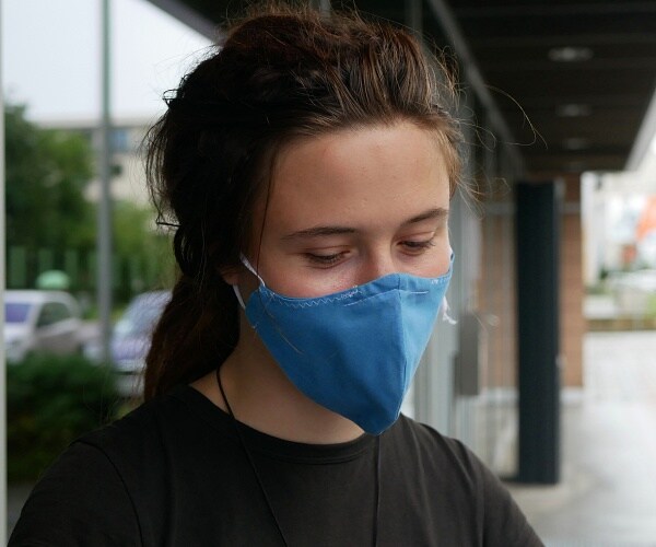 woman wearing mask outside