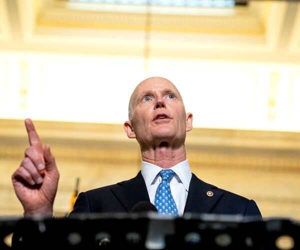 rick scott speaks to press