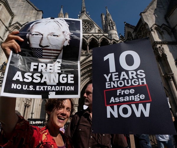 supporters of julian assange gather outside court house