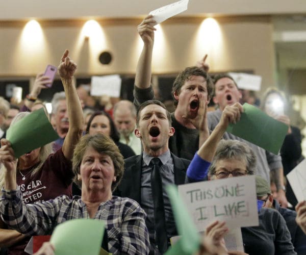 Angry Voters Flood Town Halls of GOP Lawmakers