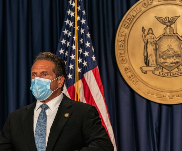 new york governor andrew cuomo wears a face mask