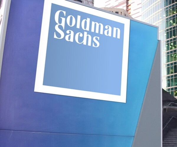 goldman sachs corporate logo in blue on sign outside building