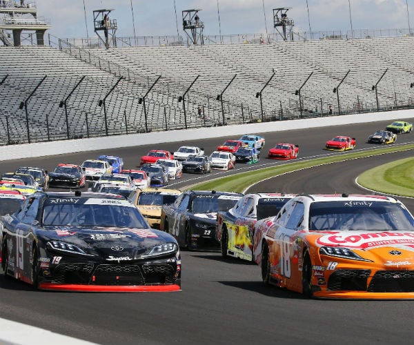 nascar drivers get set for a race in the xfinity series at the indianapolis motor speedway