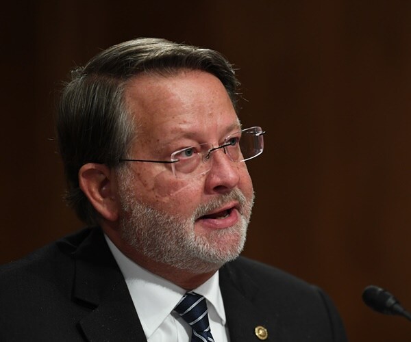 gary peters speaks during a hearing