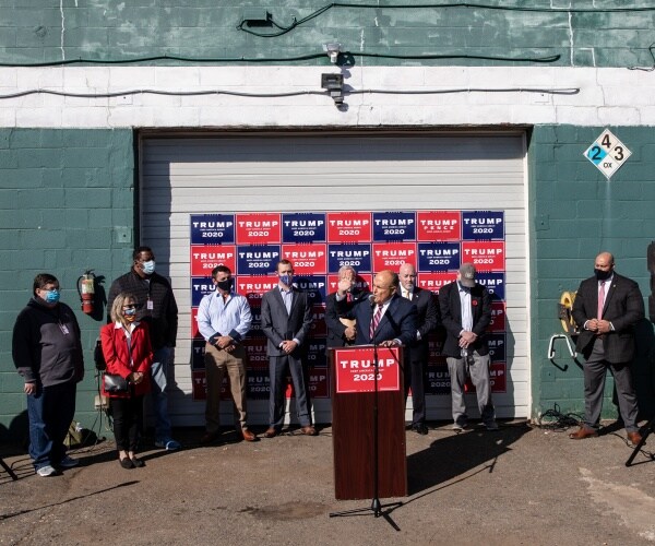 rudy giuliani and supporters hold a press conference