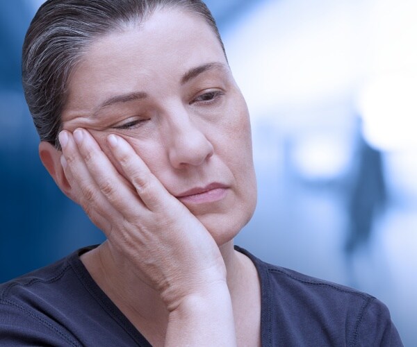 woman feeling tired, sad, sick