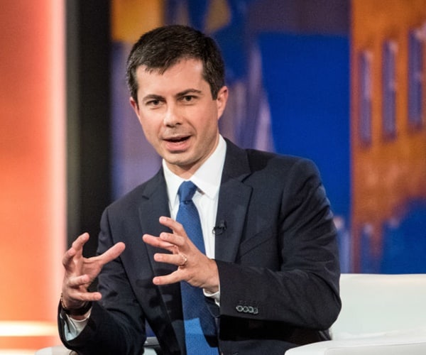 mayor pete buttigieg speaks at a forum from the stage