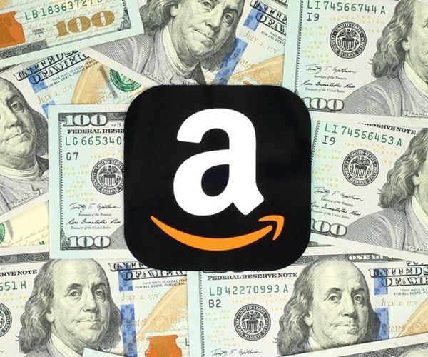 amazon corporate logo symbol emblem on background of dollars