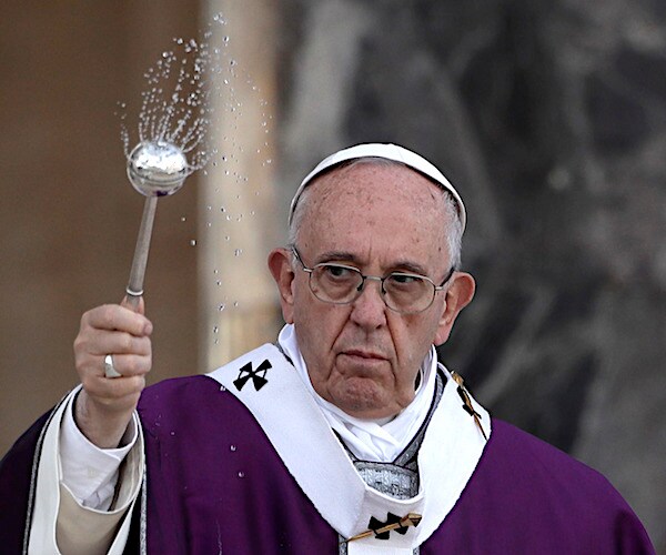 pope francis spreads holy water from a thingy