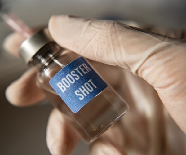 vial labeled 'booster shot' with syringe