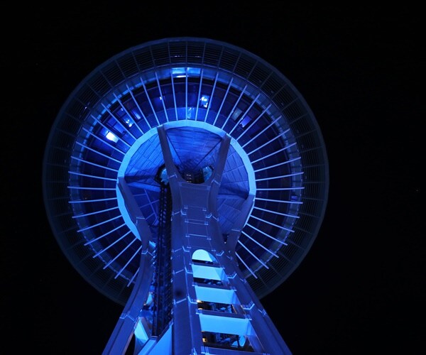 the space needle is illuminated blue