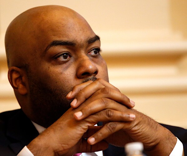 Lamont Bagby rests his chin in his folded hands during a hearing