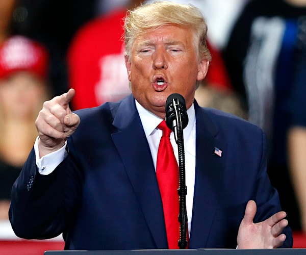 president donald trump points during a campaign rally