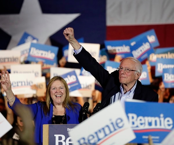 bernie and jane sanders wave to supporters at a texas rally after nevada caucuses.