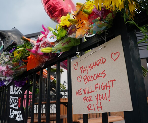 a sign near the spot where rayshard brooks died in a police shooting in atlanta