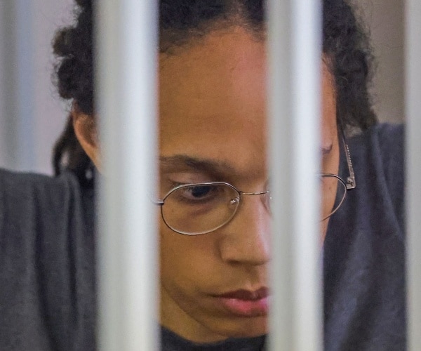 brittney griner sits inside a holding cell