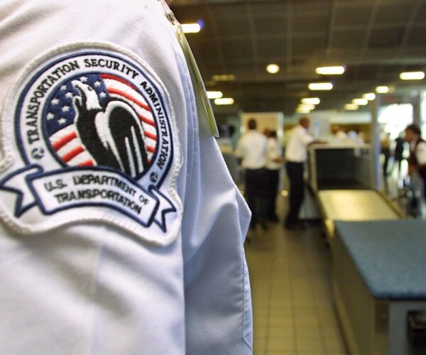 tsa badge on an official in an airport