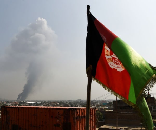 smoke rises from the site of an attack after a massive explosion the night before in kabul 