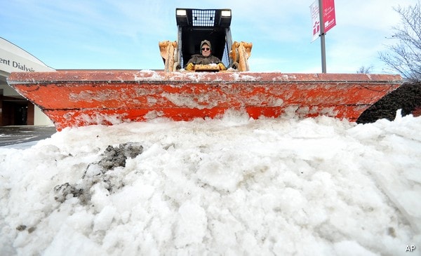 Storm Dumps Snow, Sleet, Disrupt Flights, Football