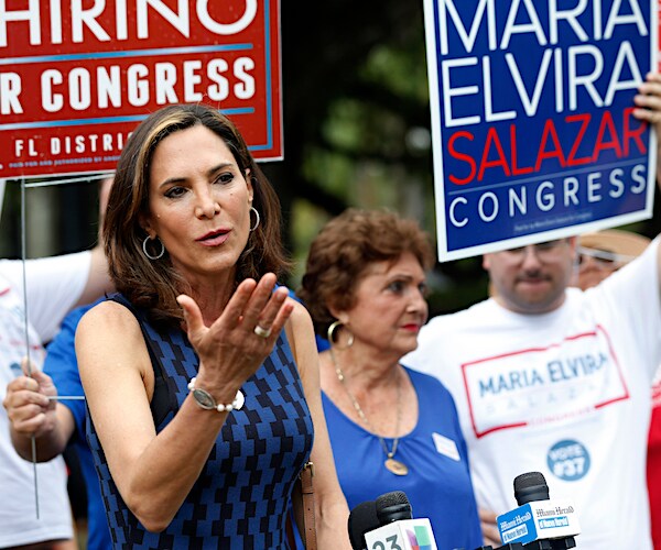 maria elvira salazar blows a kiss during a campaign rally with a throng of supporters